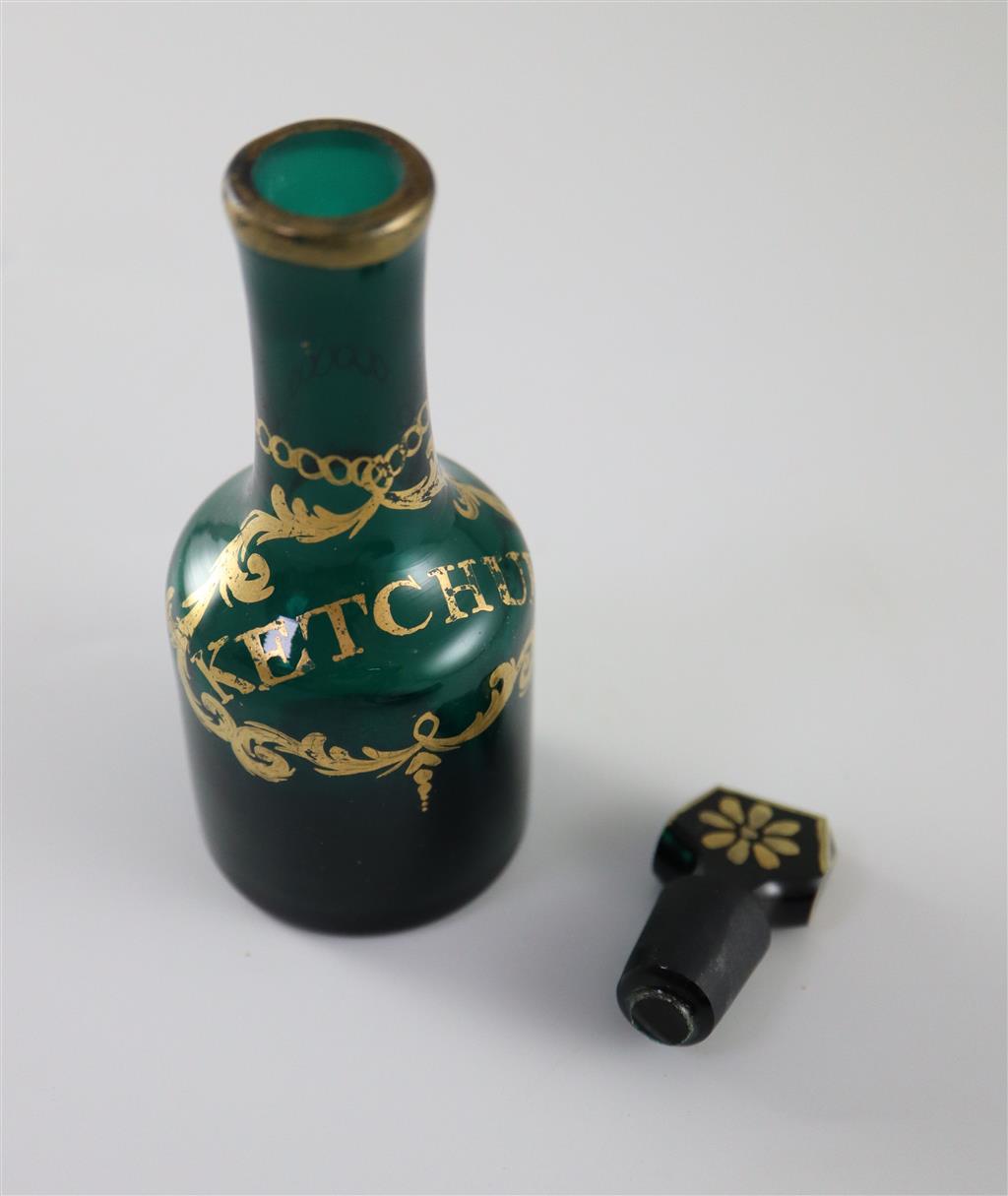 A George III green glass ketchup cruet bottle and stopper, gilded in the James Giles atelier, c.1770, 11.5cm high